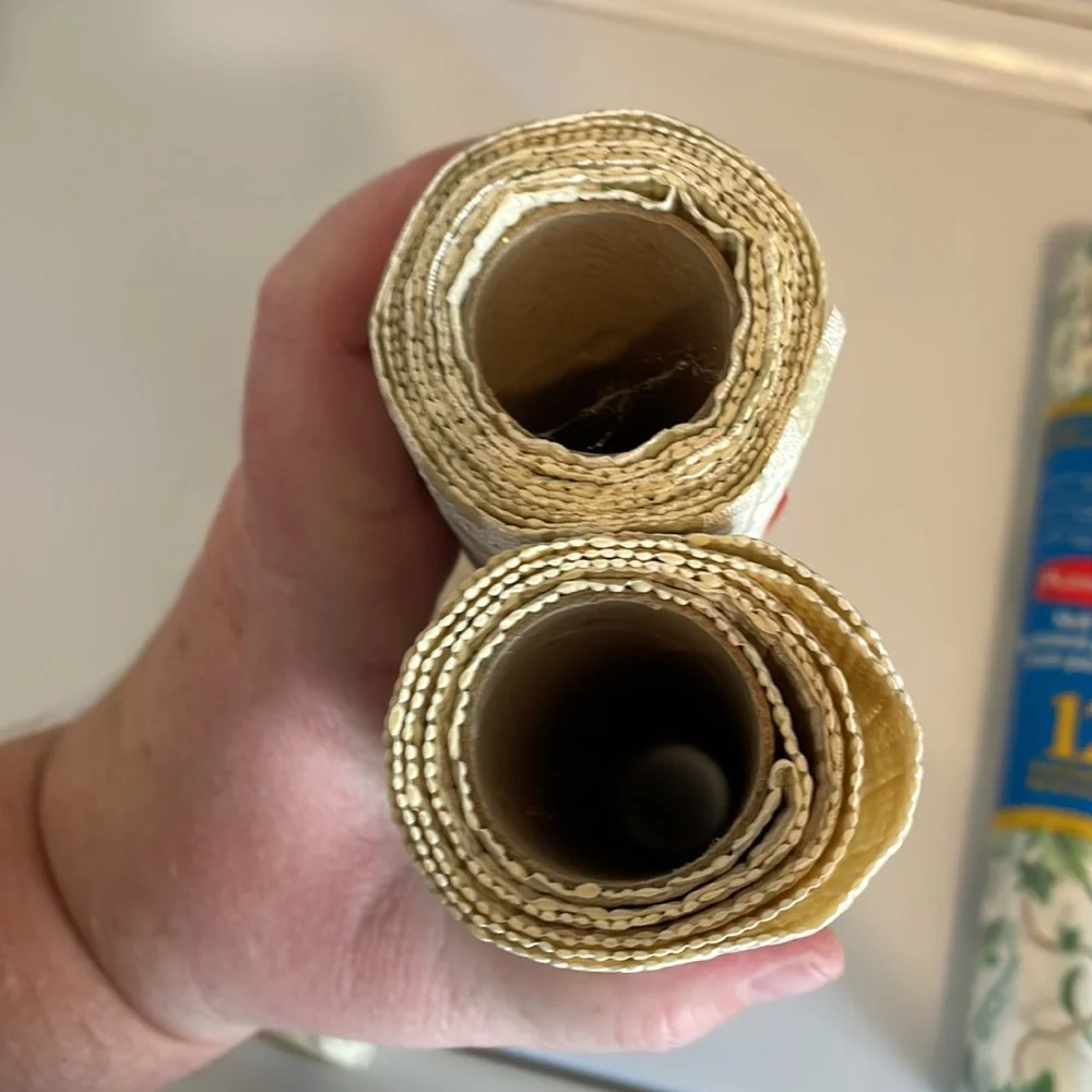 Five rolls of Rubbermaid shelf liner, some adhesive some not 3 full new rolls